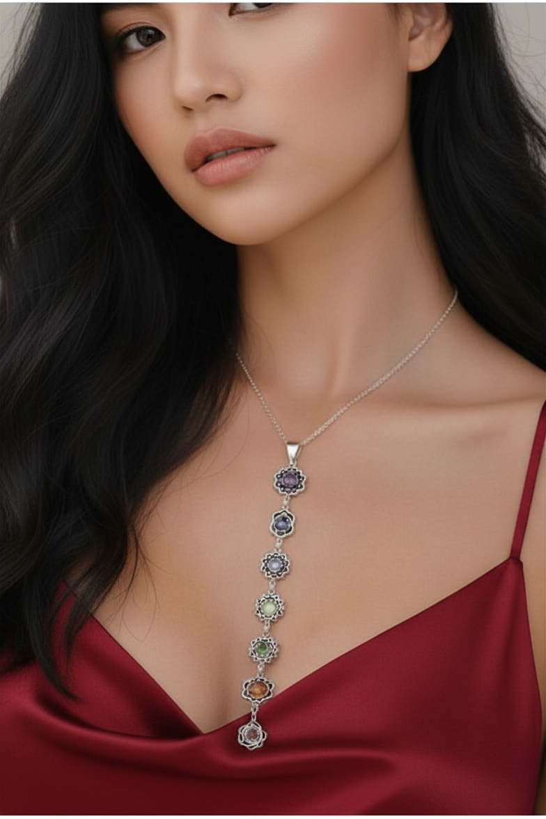 Woman wearing a silver chakra stones pendant necklace with gemstones 