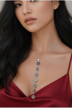Woman wearing a silver chakra stones pendant necklace with gemstones 