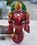 Hand Carved Wooden GANESH Hindu Elephant Deity MASK Handmade in NEPAL Sculptural Wall Hanging Decor Red - DharmaObjects